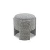 Small round stool upholstered in speckle grey fabric with wide legs overlapping the seat