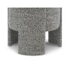 Small round stool upholstered in speckle grey fabric with wide legs overlapping the seat