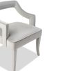 A sophisticated dining chair by Liang & Eimil with a gorgeous grey upholstery and open back design