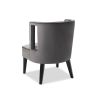 Grey chair with softly curved backrest and cut-out feature