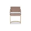 Beige velvet dining chair with art deco inspired arched arms in brass