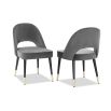 Dark grey velvet upholstered dining chair with arch detail black legs and brass cap feet 