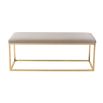 A luxury bench by Liang & Eimil with a polished brass finish and velvet upholstery