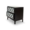 A statement bedside table by Liang & Eimil with a glass and dark wood finish