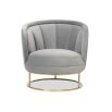 Grey velvet shapely chair with tubular brushed brass base and channelling