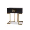 Black wood side table with geometric brass details