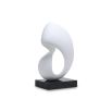 White abstract sculpture with a square black base