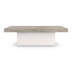 A contemporary coffee table by Caracole with a modern design, clean lines and a travertine stone top