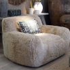 Cosy, wooly wide silhouette armchair in neutral colour