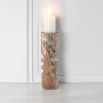 Coffee-coloured marble candle holder with cut-out design