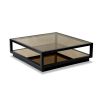 Bold black edged coffee table with antique gold finish glass top and bottom