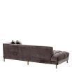 Grey velvet corner sofa with brass finish accents