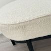 An elegant bench by Eichholtz with a luxury bouclé cream upholstery and beautiful black finished frame