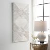 A gorgeous geometric wall artwork with a white washed finish