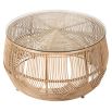 Natural looking coffee table in rattan design with glass top