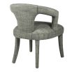 Upholstered dining chair in cut out design in green/grey finish