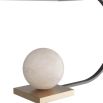 Sculptural lamp with swooping bronze arm, curved brass shade and alabaster orb on base 