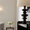 Black side lamp with sculpted wooden silhouette