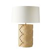 Geometric cut-out, travertine-style lamp with a cream shade