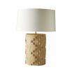 Geometric cut-out, travertine-style lamp with a cream shade