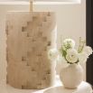 Geometric cut-out, travertine-style lamp with a cream shade