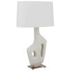 Ivory man-made stone lamp resting on simple antique brass base