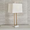 Rich brass table lamp with floating crystal quartz between metal frame