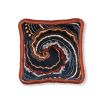 Black cushion with brown and blue swirl pattern and orange fringe