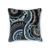 Black cushion with blue and orange swirl pattern