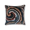 Black cushion with blue and orange swirl pattern