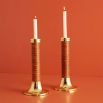 Brass candle holders with brown hand-coiled reeds