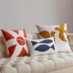 White cushion with yellow doves design 