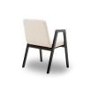 Modern dining chair with black wood arms and cream upholstery