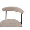 set of two dining chairs with black frame and boucle upholstered back rest and round seat