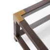 A stylish coffee table by Theodore Alexander with brushed brass corners