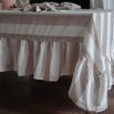 Tablecloth with colourful stripe design and ruffled edges