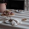 Tablecloth with colourful stripe design and ruffled edges