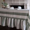 Tablecloth with colourful stripe design and ruffled edges