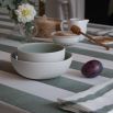 Tablecloth with colourful stripe design and ruffled edges