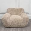 Cosy, wooly wide silhouette armchair in neutral colour