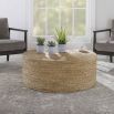 Round coffee table covered in natural rope weave