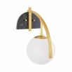 Sleek wall sconce with a backplate of black marble and opal glass globe