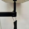 floor lamp with black metal frame and white shade