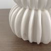 A glamorous small white stoneware vase