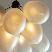 Divine ceiling lamp with bronze frame and balloon style, cream glass light fixtures.