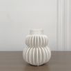 A glamorous small white stoneware vase