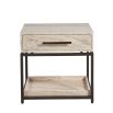 Sublime Travertine Bedside Table framed by gorgeous dark metalwork