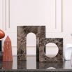 Rich brown marble sculpture in elegant curve design