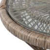 Brown rattan hourglass-shaped side table