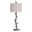 This rustic table lamp features a deep bronze finish with silver undertones and an off-white linen shade